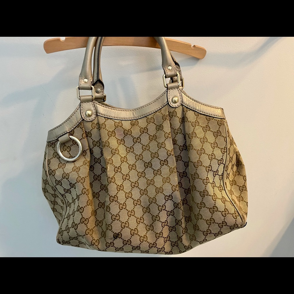 Well-loved authentic Gucci Canvas tote. Purchased new in Vegas 10 years ago.